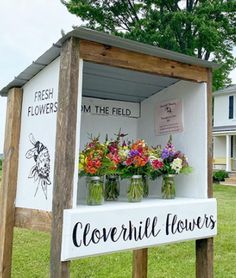 a sign with flowers in mason jars on the side of it that says, i'm the field