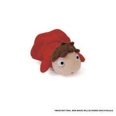 a small stuffed animal with a red hat on it's head, laying down