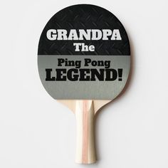 a ping pong paddle with the words grandpa the ping pong legend on it