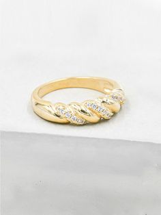 Can't get enough of dome rings? We got you covered. This braided dome ring is inspired by vintage styles and features cubic zirconia's wrapped around the band. Dome is approximately 7mm wide.  Gold or Rhodium plated with cubic zirconia. Listing is for one ring. Images are meant to show you how the ring fits/looks on the hand. All other jewelry in images are available in my shop or my website. Please read my shop policies to learn more about the composition and proper care for each item purchased Ring Images, Dome Rings, Ear Cuff Piercing, Silver Coin Necklace, Friendship Ring, Eternity Ring Gold, Friendship Rings, Braided Ring, Gold Ear Cuff