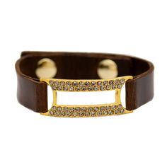 We love to stack this bracelet with our other sparky favorites! Rebel Designs creates this adjustable strap in Italian Leather with two snap closures, either in Black or Dark Brown. The center of the bracelet features an open-style rectangle of 18k Yellow Gold Plated Metal, set with Swarovski Crystals in a "black diamond" shade. Approx. Length: 7-8" Adjustable Rectangle Approx. 1.5" Available in Black or Dark Brown Leather if desired leather color is not available in the drop-down menu, it is ou Dark Brown Leather, Black Diamond, Italian Leather, Swarovski Crystals, Dark Brown, Brown Leather, Adjustable Straps, Black Leather, Yellow Gold