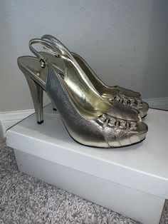 NIB Calvin Klein Portia Tumbled Leather Metallic Slingback Heels sz 8. Never worn and new in box. Beautiful Slingbacks made of tumbled leather. Chic and versatile. There is a bit scuffing on the shoes due to being stored. Hardly noticeable, but please review pics prior to purchasing. Some stains on box during storage, but does not affect shoes. Color: PLT Size: 8M Heel approx 5 inches tall Retails: $289 plus tax Please know your size and ask all questions prior to purchasing for all sales are fi Leather Platform Slingback Pumps For Party, Party Leather Platform Slingback Pumps, Formal Faux Leather Slingback Pumps With Heel Strap, Calvin Klein Leather Heels For Formal Occasions, Formal Faux Leather Slingback Pumps, Elegant Slingback Faux Leather Heels, Formal Slingback Heels In Faux Leather, Faux Leather Slingback Heels For Formal Occasions, Formal Faux Leather Slingback Heels