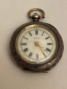 This is a silver ladies pocket watch. It is marked M W Co. It measures approximately 3.5cm diameter. Please see photos for condition. Silver Locket Watch For Formal Occasions, Antique Silver Pocket Watch For Formal Occasions, Pocket Watch Aesthetic, Silver Pocket Watch With Locket For Formal Occasions, Antique Pocket Watch With Stopwatch, Silver Locket Pocket Watch For Formal Occasions, Silver Timeless Pocket Watch With Stopwatch, Silver Watches With Stopwatch, Vintage Jewelry Aesthetic