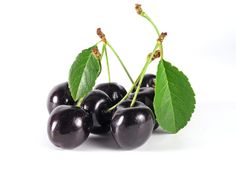 black cherries with green leaves on white background