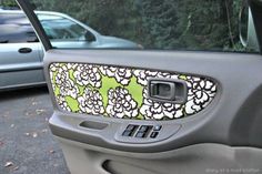 a car door is decorated with flowers and leaves