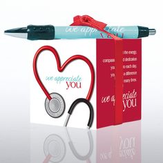 a red box with a stethoscope in the shape of a heart and an i love you card