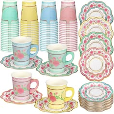 a collection of tea cups and saucers with matching plates in the shape of flowers