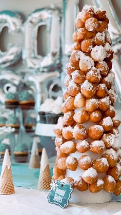 donuts stacked on top of each other in the shape of a christmas tree