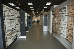 a room filled with lots of different types of glasses on display next to each other