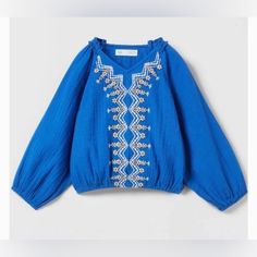 Nwt Zara Girl Embroidered Blouse With Subtle Ruffles On The Neckline And Elastic Hem And Cuff Size 6y Excellent Condition Blue Embroidered Long Sleeve Top, Blue Long Sleeve Embroidered Tops, Blue Embroidered Long Sleeve Peasant Top, Blue Long Sleeve Peasant Top With Floral Embroidery, Organza Blouse, Girls Crop Tops, Lace Trim Top, Gingham Tops, Zara Girl