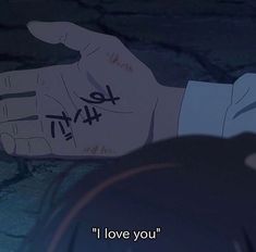 someone holding their hand up with the words i love you written on it