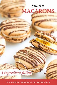 some cookies with chocolate frosting and peanut butter on top are arranged in rows, one is cut in half to show the inside