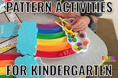 a child is playing with rainbow colored play dough