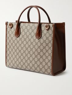 Gucci's tote bag combines the hallmarks of the 'Ophidia' collection from 2018 with the iconic 'GG Supreme' monogram from the 1930s. Made in Italy from durable coated-canvas and brown leather, it's built to hold its structured shape, fully lined in canvas and has the option of a shoulder strap or top handles. Gucci Tote Bag Canvases, Tote Bag For Men, Gucci Gg Bag, Tote Bag Outfit, Shop Gucci, Gucci Collection, Gucci Coat, Leopard Tote, Big Handbags