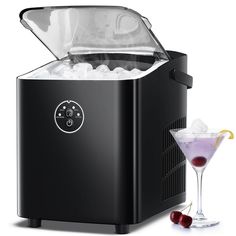 a small ice maker with a martini in front of it