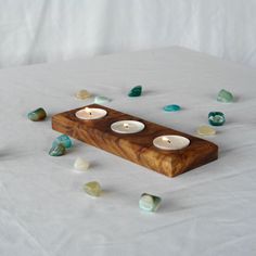 Elevate your home decor with our Handcrafted Wooden Tea Light Candle Holder. Designed to hold three candles, this rustic centerpiece adds warmth and charm to any room. Carefully crafted by artisans, it's perfect for cozy evenings or special gatherings. Bring authentic elegance to your space with this beautiful, natural piece! Wooden Candle Holder, Wooden Tealight Holder, Wood Cube Candle Holder, Rustic Tealight Holder, Wooden Multiple Candle Holder, Tea Light Wooden Candle Holder, Wooden Tea Light Holder, Beeswax Pillar Candles, Honey Candle