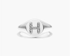 14K White Gold Diamond H Initial Signet Ring. This timeless ring will dazzle all who see it. Perfect for any age and occasion, this ring makes the perfect individualized gift! Luxury 14k White Gold Signet Ring, Formal Silver Initial Ring With Diamond Accents, Luxury White Gold Round Cut Signet Ring, Classic Silver Initial Ring With Diamond Accents, Classic White Gold Initial Ring With Diamond Accents, White Gold Diamond Initial Ring With Round Band, Personalized Fine Jewelry Diamond Ring With Round Cut, Personalized Round Cut Diamond Ring, Classic White Gold Initial Diamond Ring