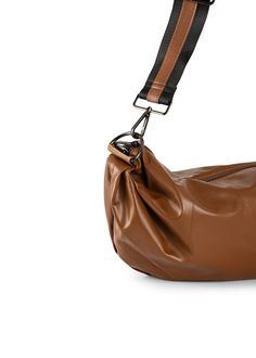 a brown leather bag with a black strap hanging from it's side, on a white background