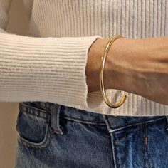 Our Gold Cuff Bangle is the perfect minimalist bangle with a glossy finish. This chic bangle is great for wearing alone or stacked with other bangles. Please note this bangle is not adjustable. Add a touch of elegance to any outfit with our Gold Open Cuff Bangle. This sleek and glossy bangle is a must have for any jewellery collection. Whether you wear it alone as a statement piece or stack it with other bangles, this versatile accessory will elevate your style. With it's durable non adjustable Gold Cuff Bangle, Jewellery Minimalist, Minimalist Bangle, Stacking Bangles, Minimalist Jewellery, Bangle Gold, Open Cuff Bracelet, Jewellery Gifts, Stacked Bangles