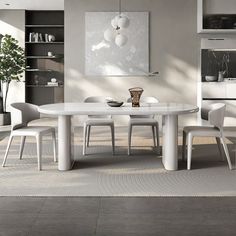 a white table and chairs in a room