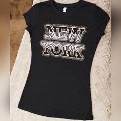 Brand: Miss Posh Size: Us M Condition: Like New (Unworn) Details: The "New York" Portion Has Gold And Silver Glitter. The T-Shirt Is Also Sheer With A Pattern (As Shown In The Photo) And Stretchy. Materials: 55% Cotton, 45% Polyester Note:(Preferably) No Refunds Or Returns!! Please Thoroughly Look At The Photos And Read The Description. If You Have Any Questions Or Want Additional Photos, Do Not Hesitate To Ask!!! Black Cotton T-shirt With Glitter Print, Black T-shirt With Glitter Print And Short Sleeves, Black Short Sleeve T-shirt With Glitter Print, Black Cotton Top With Glitter Print, Graphic Tee With Letter Print For Night Out, Black Glitter Print Graphic Tee, Black Graphic Tee With Glitter Print, Trendy Black T-shirt With Glitter Print, Fitted Glitter Print Crew Neck Top