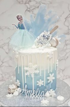 a frozen princess cake with icing and decorations