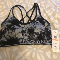 Calvin Klein Sports Bra Size Small, Removable Cups Supportive Calvin Klein Activewear For Workout, Black Seamless Activewear For Spring, Casual Gray Sports Bra For Training, Calvin Klein Casual Activewear For Gym, Spring Black Stretch Sports Bra, Spring Sports Bra In Black, Gray Sports Bra For Training, Spring Gray Activewear For Gym, Gray Spring Activewear For Gym