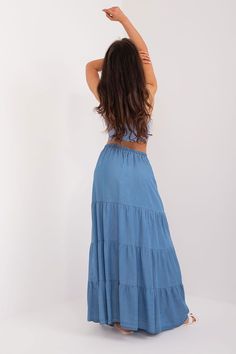 The casual long skirt is an excellent choice for everyday occasions, as well as for work. Its main asset is the smooth, minimalist design, which adds elegance and subtlety. Made mainly of tencel, the skirt provides not only a stylish look, but also comfortable to wear and durable material. Its midi length makes it suitable for both formal meetings at work and informal after-hours outings. No matter the occasion, this skirt fits perfectly into a casual yet professional style. ~Tencel 100 % Size C Spring Rayon Maxi Skirt, Spring Maxi Skirt In Solid Color, Solid Rayon Skirt For Summer, Beach Maxi Skirt In Solid Color, Beach Tiered Maxi Skirt In Solid Color, Beach Maxi Tiered Skirt In Solid Color, Versatile Solid Color Flared Maxi Skirt, High-waisted Maxi Skirt For Day Out, Flowy Maxi Skirt For The Beach