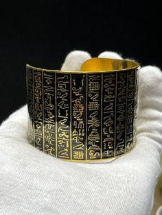 Egyptian bracelet made in Egypt. Premium quality. Handmade from Brass with amazing Gold 18k karat, Specially made for you ;) A very unique piece you will never find it anywhere ;) Note: You can use this bracelet whatever the size of your hand because it is a free size bracelet Handmade Symbolic Bangle Bracelets, Collectible Gold Jewelry With Unique Design, Symbolic Handmade Metal Bracelets, Unique Handmade Ceremonial Bracelets, Spiritual Gold Bangle Bracelet As Gift, Gold Etched Bracelet, Handmade Ceremonial Bracelets, Symbolic Brass Bracelets As Gift, Handmade Symbolic Metal Bracelets