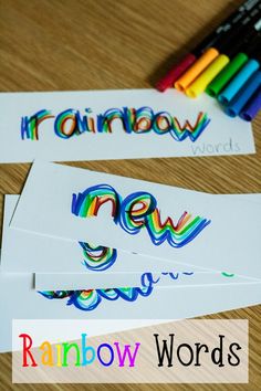 rainbow words are shown with crayons on the table