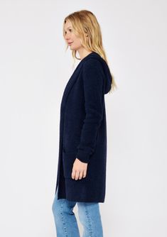 An ultra warm and cozy mid-length hooded cardigan in navy. Fuzzy texture Relaxed fit Long sleeve Mid-length Hooded Open front Patch pockets Women's fall cardigan Dry clean only Embrace all the cozy vibes in this ultra-soft long cardigan - your new Fall favorite! This versatile layering piece features an open front, a comfy hoodie, long sleeves, and convenient patch pockets. You'll find yourself reaching for this easy fit style all season long. Model is 5'7.5, wearing a size S.Style: I-51072K-SLQ Navy Long Sleeve Winter Cardigan, Comfy Soft Knit Outerwear For Cold Weather, Navy Knit Winter Outerwear, Navy Knit Outerwear For Winter, Blue Hooded Winter Cardigan, Cozy Blue Soft Knit Outerwear, Cozy Blue Sweater Coat For Winter, Blue Hooded Cardigan For Fall, Cozy Hooded Sweater Coat For Cold Weather