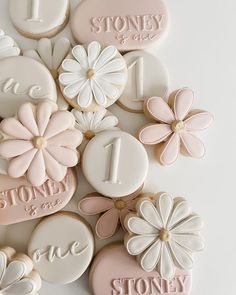 some cookies are decorated with flowers and the number one is for stoney & clay