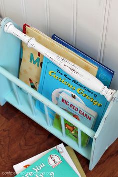 a blue book holder with books in it