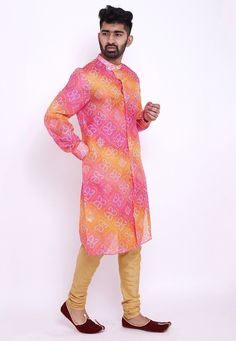 Readymade Art Kota Silk Front Open Kurta in Shaded Pink and Mustard. This Collar Neck and Full Sleeve attire is Prettified with Buttons, Bandhej and Foil Print and has Two Side Pockets. Available with an Art Silk Churidar in Beige. Do note: Footwear shown in the image is for presentation purposes only. Half to one inch may vary in measurement. (Slight variation in actual color vs. image is possible). We sell all kinds of menswear. Mens Kurta | Mens Kurta Pajama | Mens Sherwani | Mens Sherwani Se Multicolor Ikat Print Sets With Long Sleeves, Multicolor Long Sleeve Sets With Ikat Print, Pink Long Sleeve Sets With Bandhani Print, Multicolor Long Sleeve Traditional Wear For Diwali, Multicolor Printed Motifs Long Sleeve Kurta, Multicolor Long Sleeve Kurta With Printed Motifs, Long Sleeve Multicolor Kurta With Printed Motifs, Long Sleeve Multicolor Printed Motifs Kurta, Multicolor Ikat Print Straight Kurta Set