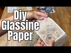 someone is making a glassine paper with their hands