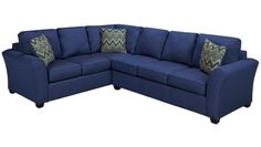 a blue sectional couch with two pillows on the back and one arm facing the corner