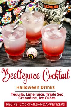 three halloween cocktails on a table with candy