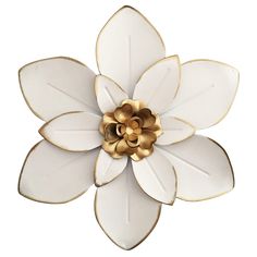 a white and gold flower brooch on a white background