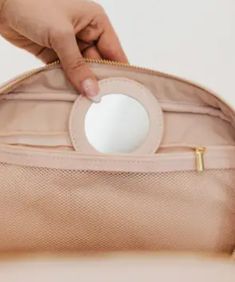 Introducing your new BFF - our Madelyn Bow Makeup Bag! This makeup bag has plenty of room for all your beauty products, hair essentials, and more. Plus, there's a zipper pocket with a compact mirror for on-the-go touch-ups. Perfect for stylish travelers and it's easy to clean too! Compact mirror inside Bag measures: 10"L x 7"W x 4.5"H Spot clean Travel Cosmetic Storage Pouch With Zipper Closure, Travel Cosmetic And Toiletry Pouch With Zipper, Compact Functional Cosmetic Bag With Zipper, Compact Functional Cosmetic Bag For On-the-go, Functional Portable Compact Cosmetic Bag, Portable Compact Functional Cosmetic Bag, Functional Compact Cosmetic Bag With Removable Pouch, Compact Travel Cosmetic Bag With Zipper, Portable Cosmetic Pouch With Zipper Closure