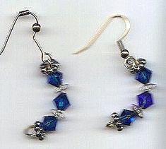 deep blue and clear crystals on goldtone ear wires, curved shape ﻿Please allow 1 extra week for custom making.approx 1.5" Blue Wire Wrapped Drop Earrings, Blue Crystal Pierced Earrings, Blue Wire Wrapped Dangle Crystal Earrings, Blue Metal Crystal Earrings With Ear Wire, Blue Crystal Earrings With Metal Ear Wire, Nickel Free Blue Crystal Earrings, Nickel-free Blue Crystal Earrings, Beaded Jewelry Earrings, Diy Jewelry Unique