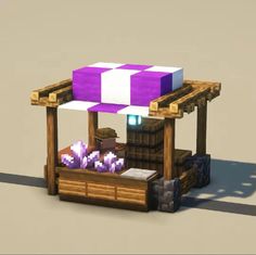 a purple and white cube sitting on top of a wooden bench next to a table