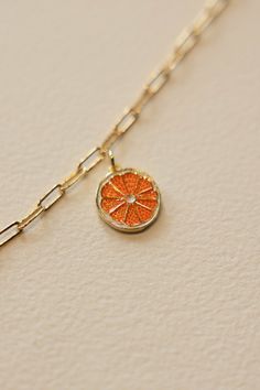 Gold filled enamel orange slice charm is sweet and summery. Add some joy to your charm necklace with this bright and summery slice. Hand make your custom charm necklace in Laguna Beach or build your piece online through adding a base necklace and your selection of charms. Leave us a note on your order for any special requests. gold filled Tarnish resistant Enamel Tiny Charms, Charm Bar, Custom Charm Necklaces, Orange Slice, Orange Necklace, Tiny Charm, Nice Outfits, Custom Charms, Ceramic Gifts