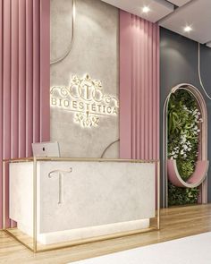 a reception area with pink and white walls