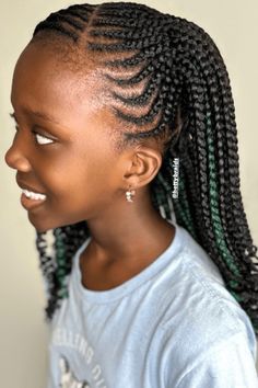 This hairstyle has cornrows that are braided neatly and start at the forehead, curving smoothly towards the back and making a complex design on the scalp. The braids have black and green pieces added in, giving a fun and colorful twist to the regular cornrow style. The ends of the braids are left loose, flowing down in curled shapes, which - Click to see more of Cute and Creative Cornrow Hairstyles for Little Ones and follow us for more hairstyle ideas. // Photo Credit: Instagram @hettybraids Cornrow Hairstyles For Kids, Creative Cornrow Hairstyles, Kids Cornrow Hairstyles, Braided Updos, Complex Design, Tight Braids, Thick Braid, Curly Ponytail, Funky Design