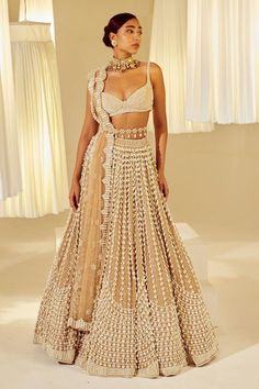 Beige attached cancan lehenga with all-over chandelier pearl embellishments. Comes with sleeveless pearl drop sweetheart neck padded blouse and a dupatta. - Aza Fashions Lehenga With Pearls, Vani Vats Lehenga, Pearl Blouse Designs, Pearl Lehenga, Sari Blouse Styles, Beige Lehenga, Vani Vats, Cancan Lehenga, Simple Lehenga