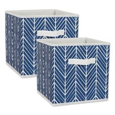 two blue and white storage bins with handles, one has an arrow pattern on it