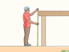 a man measuring the height of a wooden frame