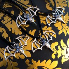 Adorable bat chokers perfect for layering this halloween season or any day! Available in Leather & Stainless Steel, your choice of size. Silver Choker For Halloween Gift, Silver Vampire Choker For Halloween, Adjustable Vampire Necklace For Halloween, Charm Choker Necklace, Leather Choker Necklace, Halloween Season, Bat, Charm Necklace, Choker Necklace