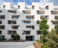 an apartment building with many balconies and windows