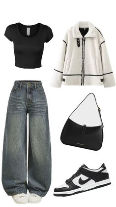 a black and white outfit with jeans, sneakers and a purse